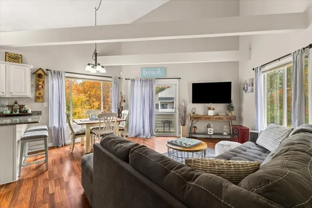a living room with furniture fireplace and a flat screen tv
