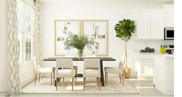 a view of kitchen with furniture and wooden floor