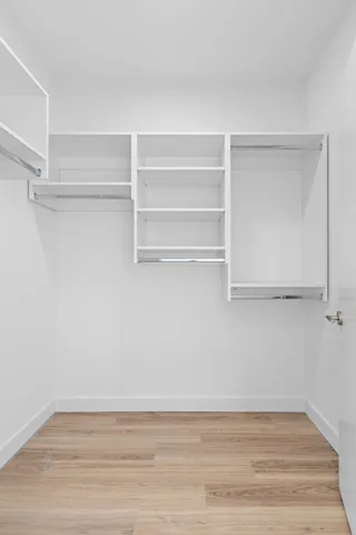 a view of an empty walk in closet