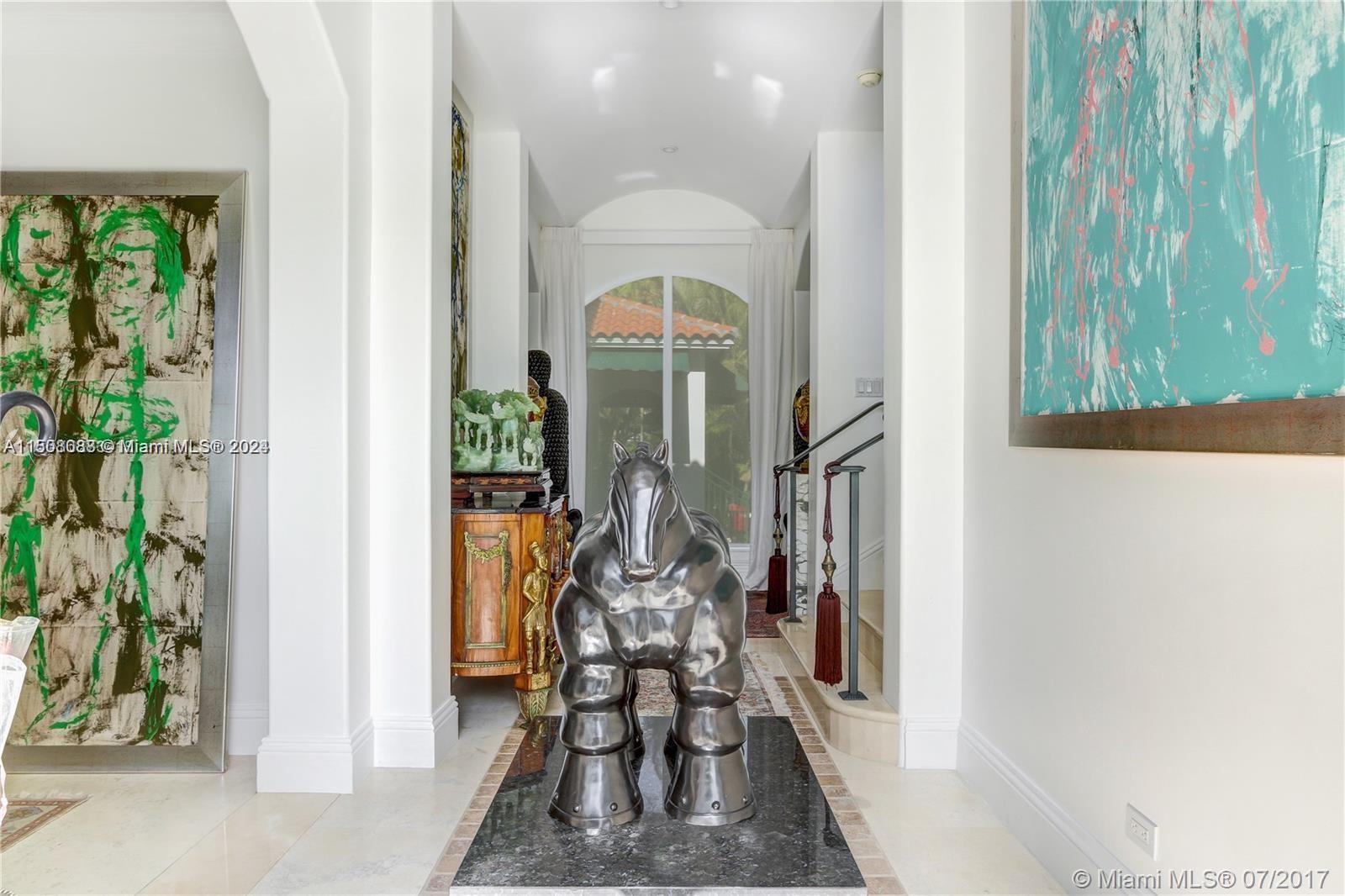 270 Ridgewood Road Key Biscayne, FL 33149 - Photo 3 of 15 a view of a hallway with seating area