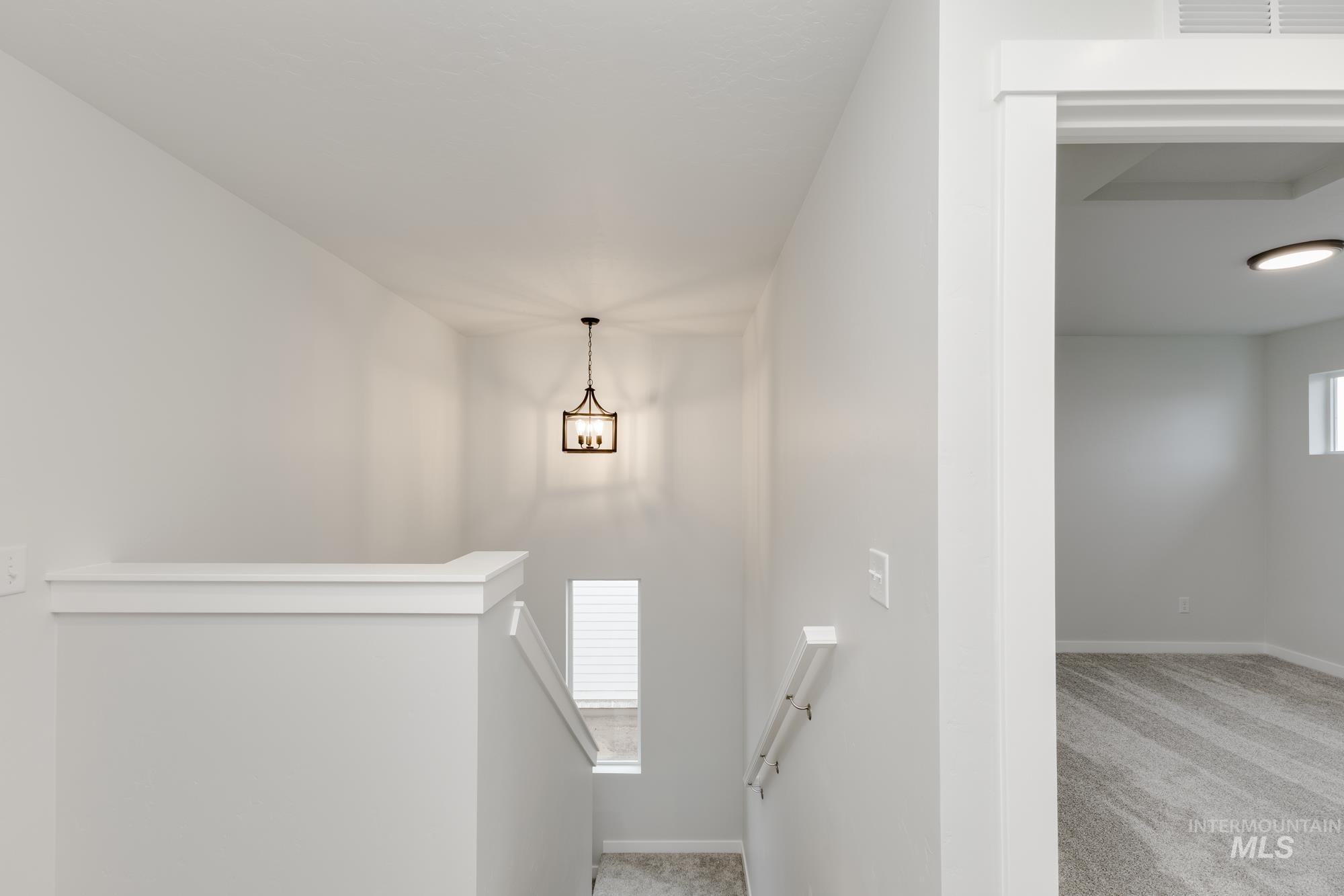 2086 South Border Way Meridian, ID 83642 - Photo 10 of 19 Staircase with carpet floors and baseboards
