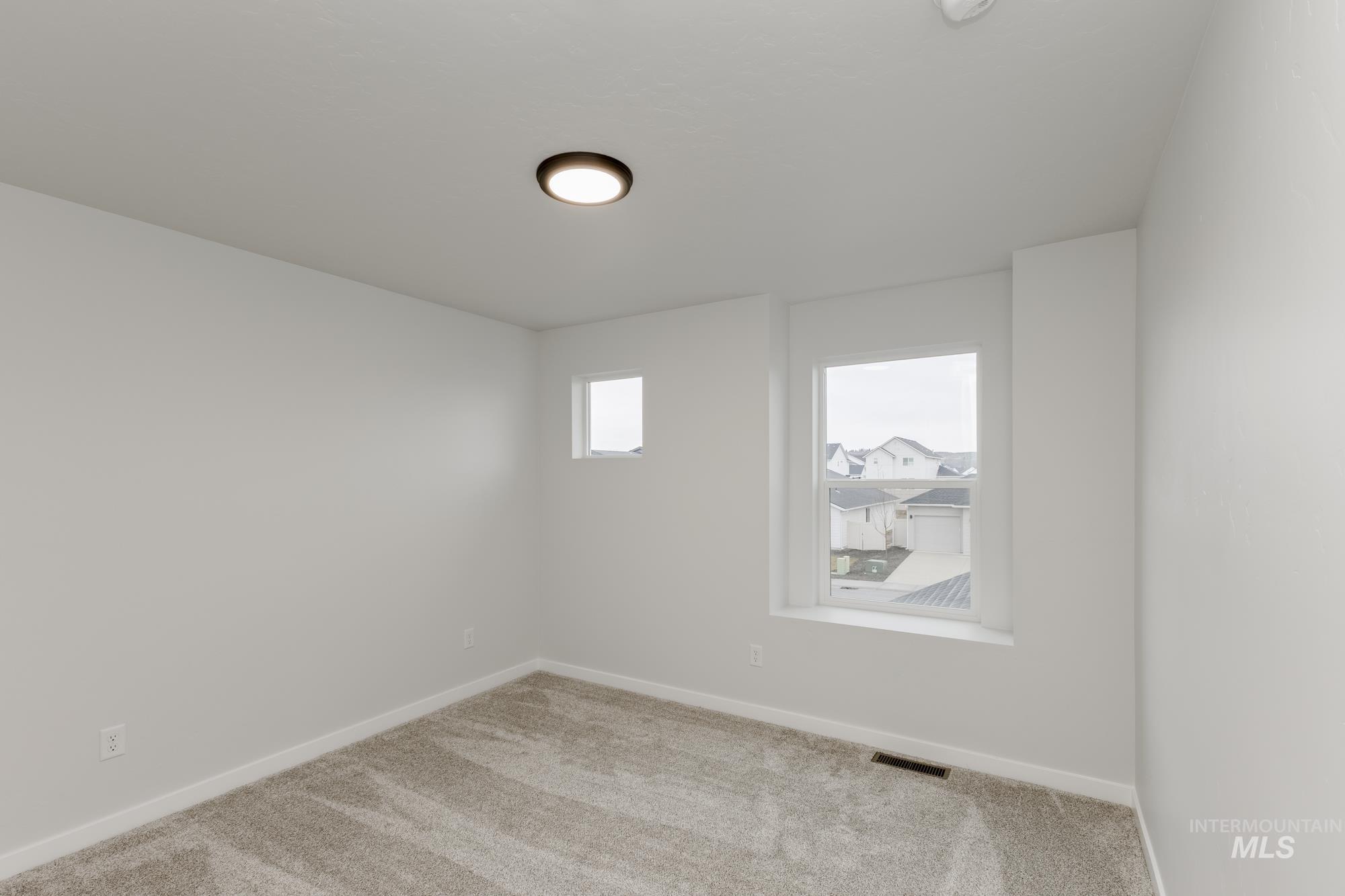2086 South Border Way Meridian, ID 83642 - Photo 11 of 19 Carpeted spare room with baseboards