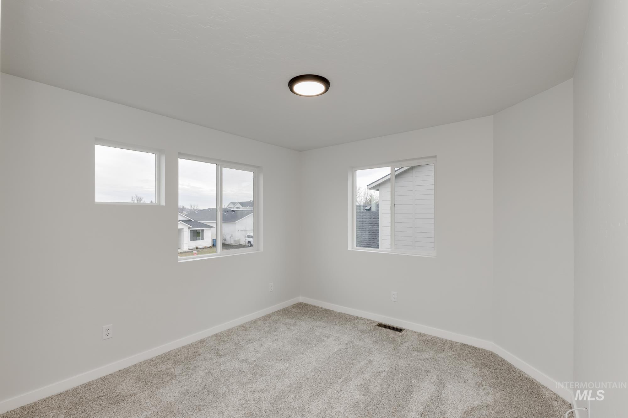 2086 South Border Way Meridian, ID 83642 - Photo 12 of 19 Empty room with carpet floors and baseboards