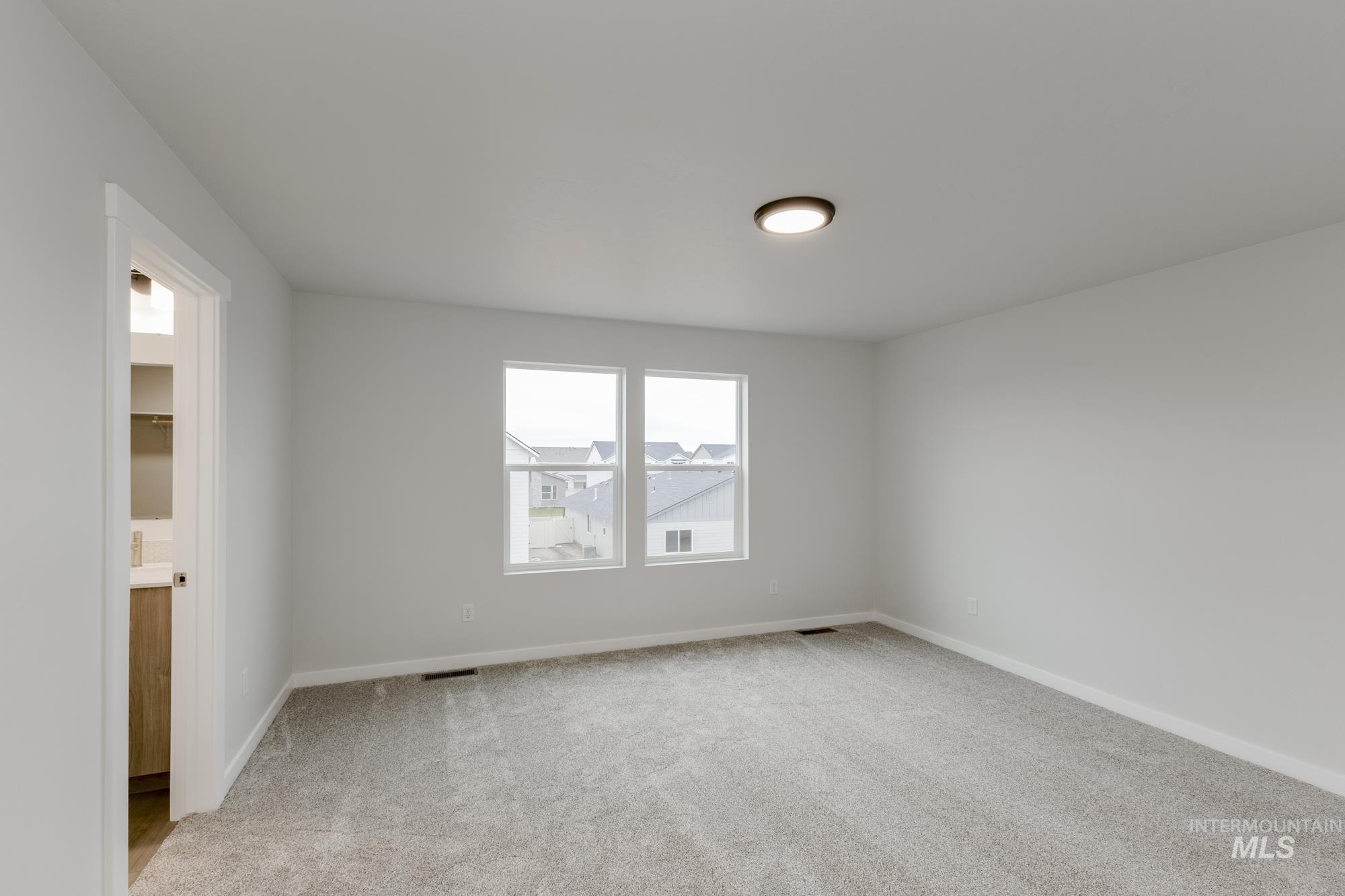 2086 South Border Way Meridian, ID 83642 - Photo 15 of 19 Unfurnished room with light carpet and baseboards