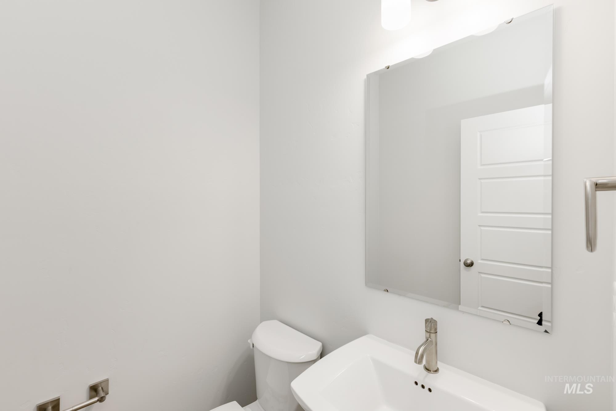 2086 South Border Way Meridian, ID 83642 - Photo 8 of 19 Half bathroom featuring toilet and a sink