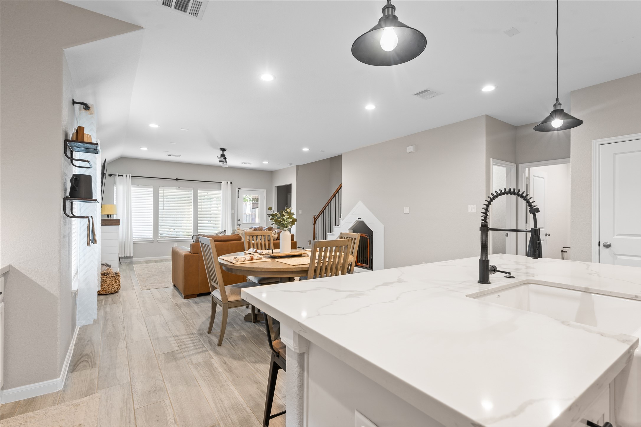 2504 Hagerman Road Conroe, TX 77384 - Photo 14 of 50 a room with stainless steel appliances kitchen island a white cabinets and wooden floor