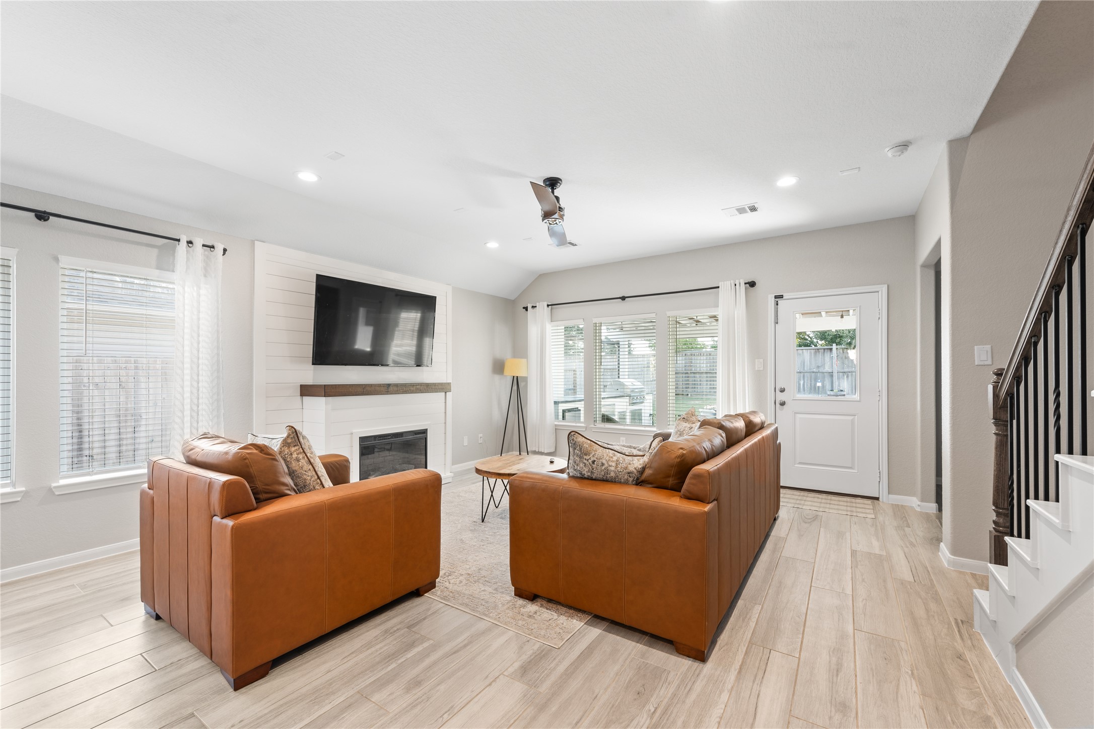 2504 Hagerman Road Conroe, TX 77384 - Photo 16 of 50 a living room with furniture and a flat screen tv