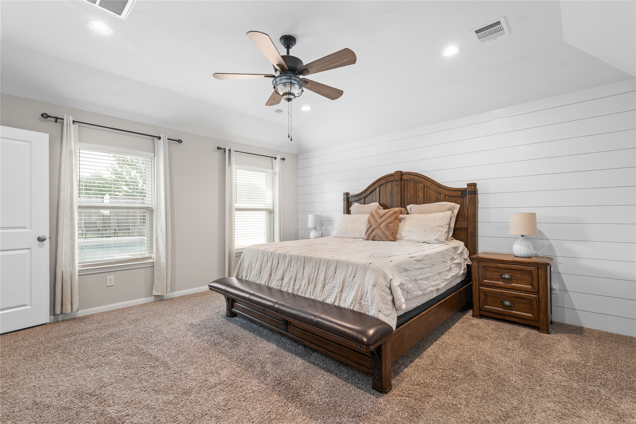 2504 Hagerman Road Conroe, TX 77384 - Photo 22 of 50 a spacious bedroom with a bed and window