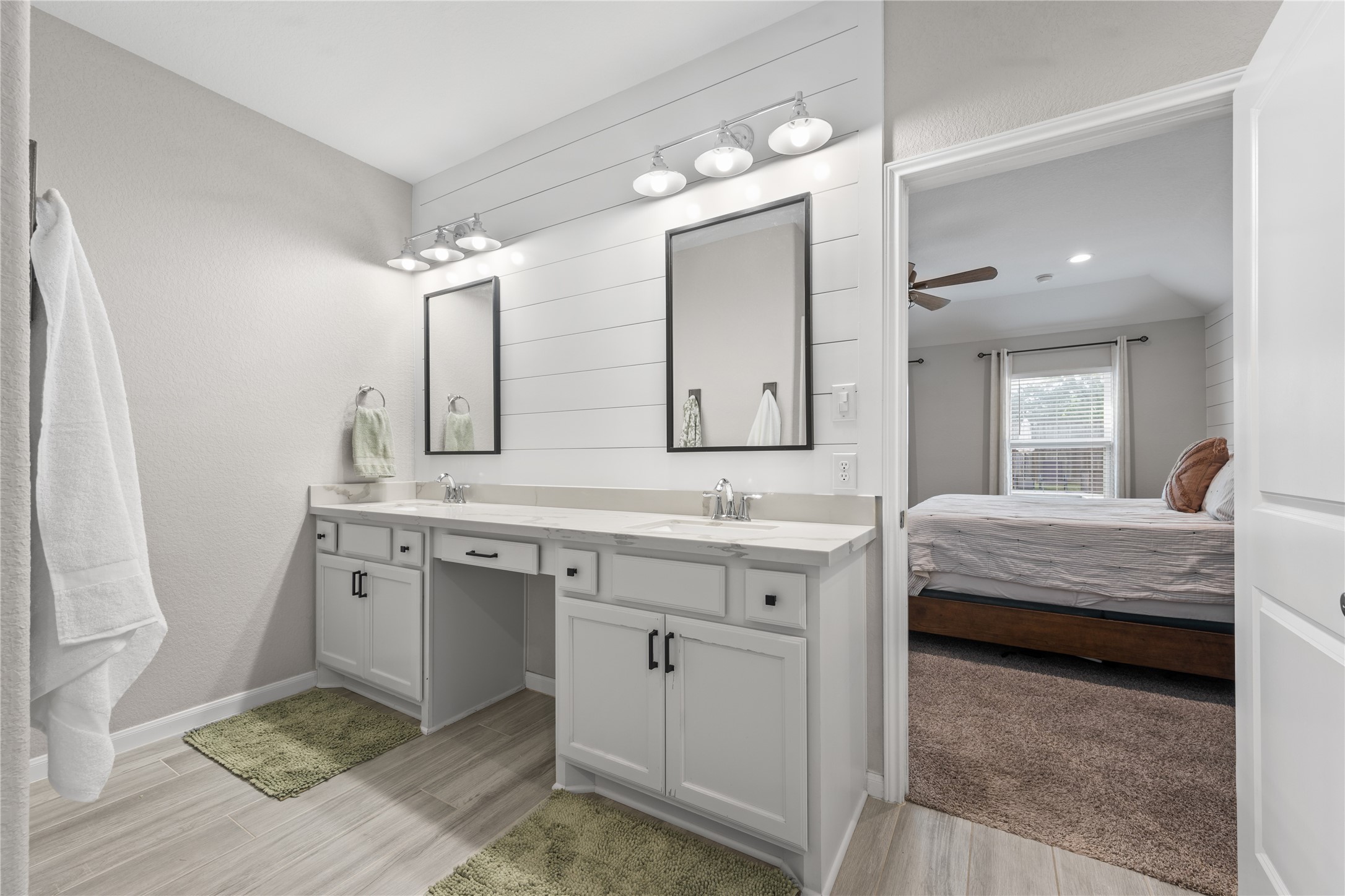 2504 Hagerman Road Conroe, TX 77384 - Photo 23 of 50 a spacious bathroom with a double vanity sink mirror and toilet