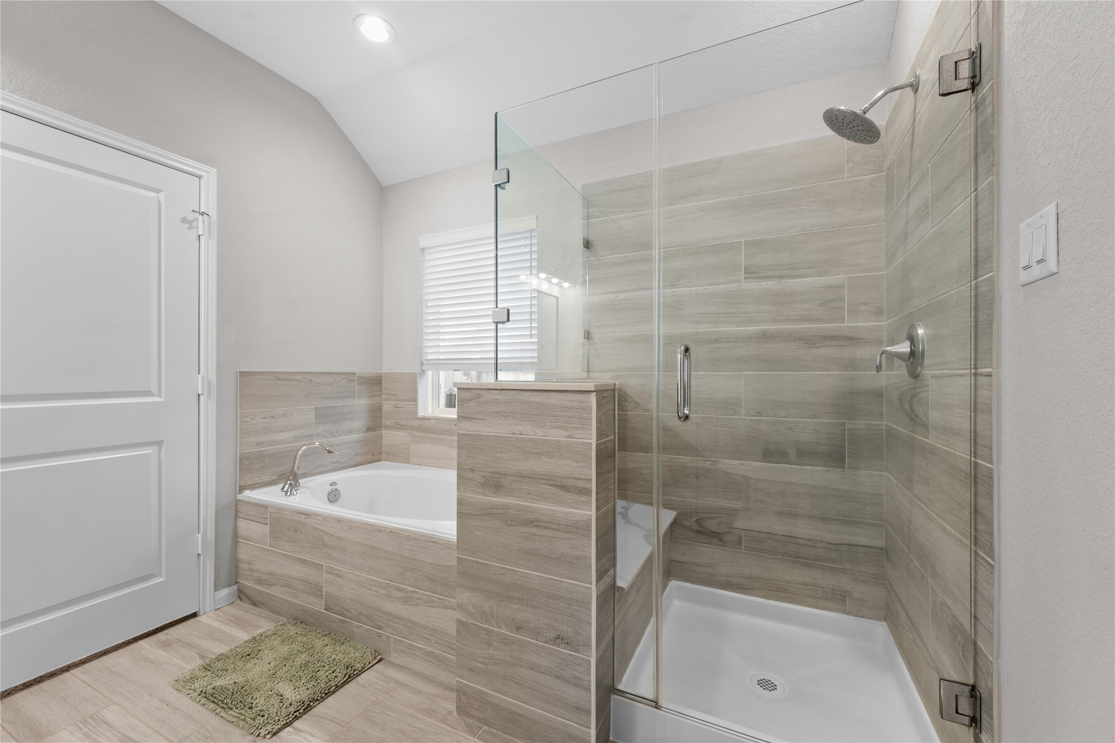 2504 Hagerman Road Conroe, TX 77384 - Photo 25 of 50 a bathroom with a bathtub and a shower