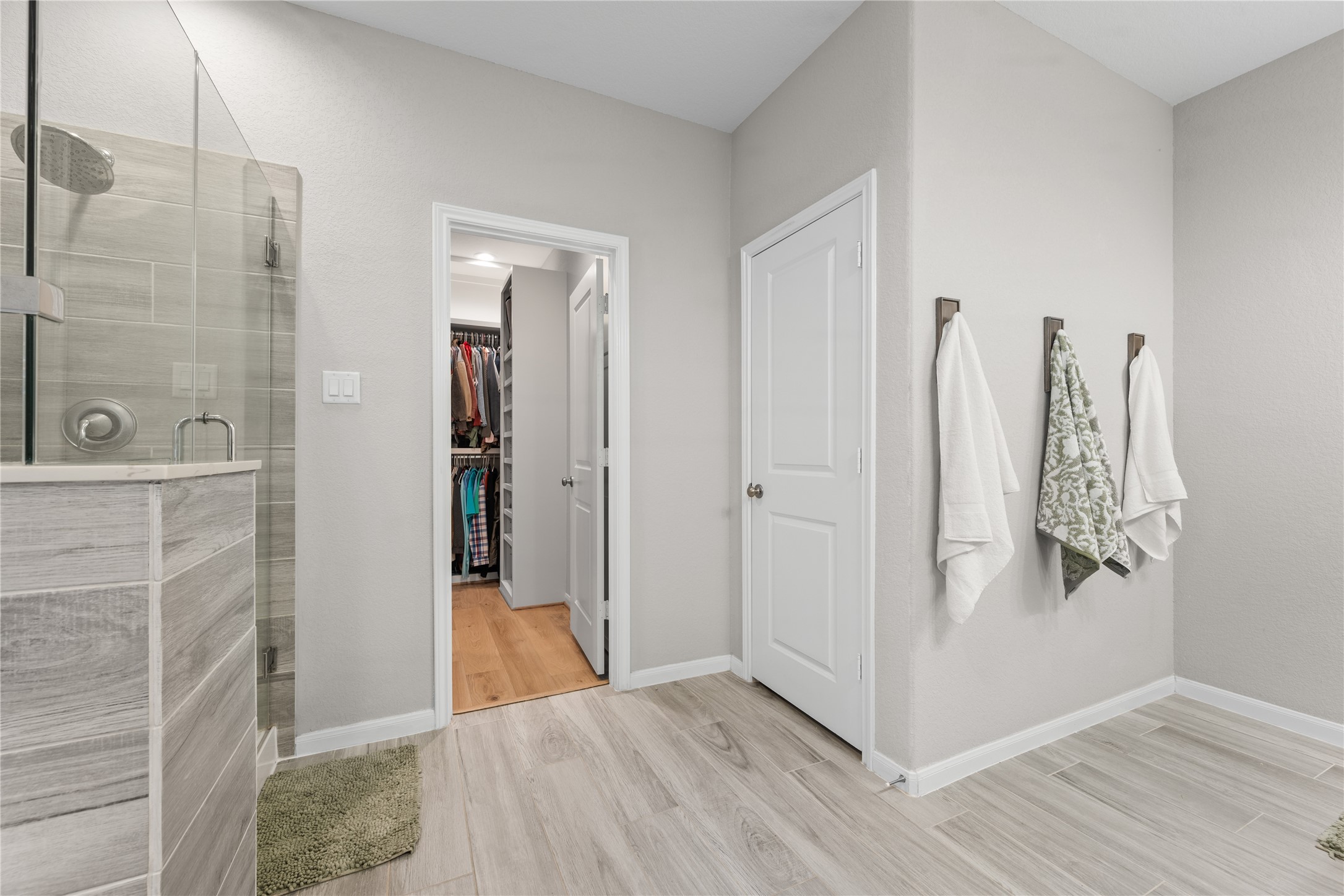2504 Hagerman Road Conroe, TX 77384 - Photo 26 of 50 a view of a bathroom with wooden floor and a bathroom
