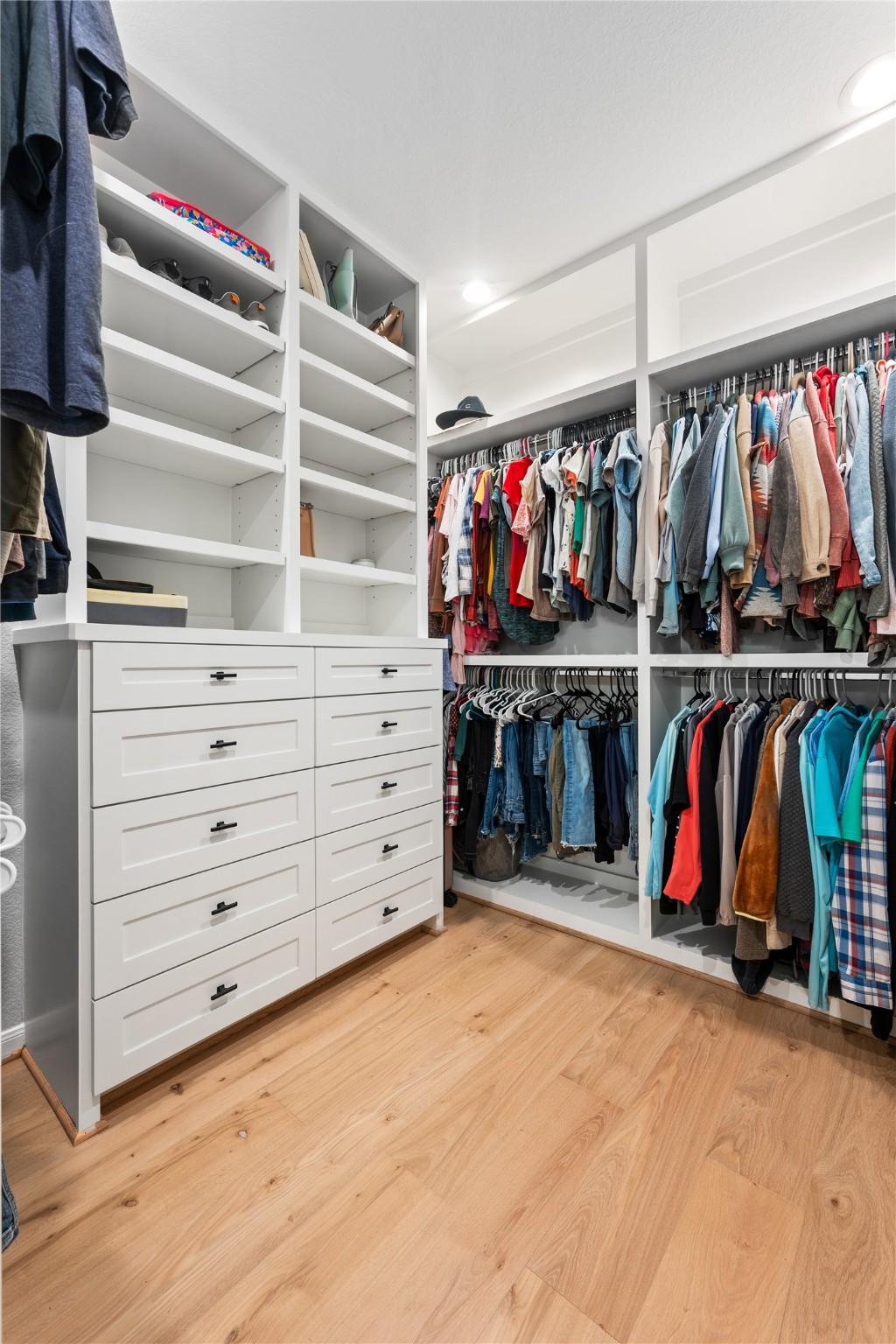 2504 Hagerman Road Conroe, TX 77384 - Photo 27 of 50 a view of walk in closet with clothes and shoes