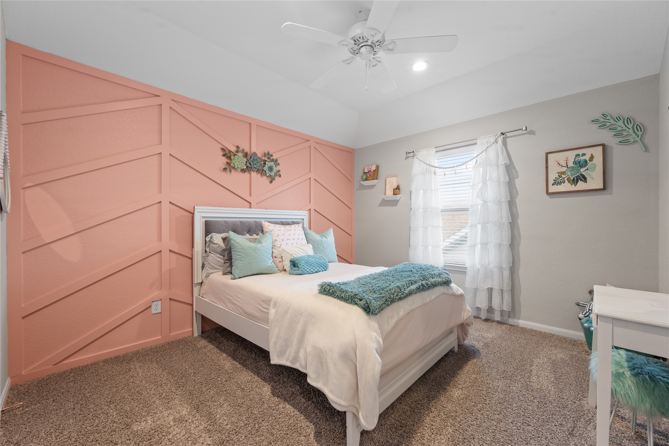 2504 Hagerman Road Conroe, TX 77384 - Photo 35 of 50 a bedroom with a large bed and a chandelier