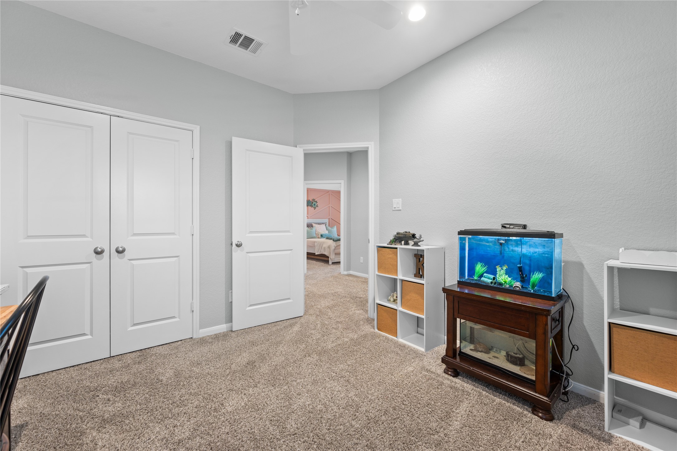 2504 Hagerman Road Conroe, TX 77384 - Photo 40 of 50 a living room with furniture and a flat screen tv