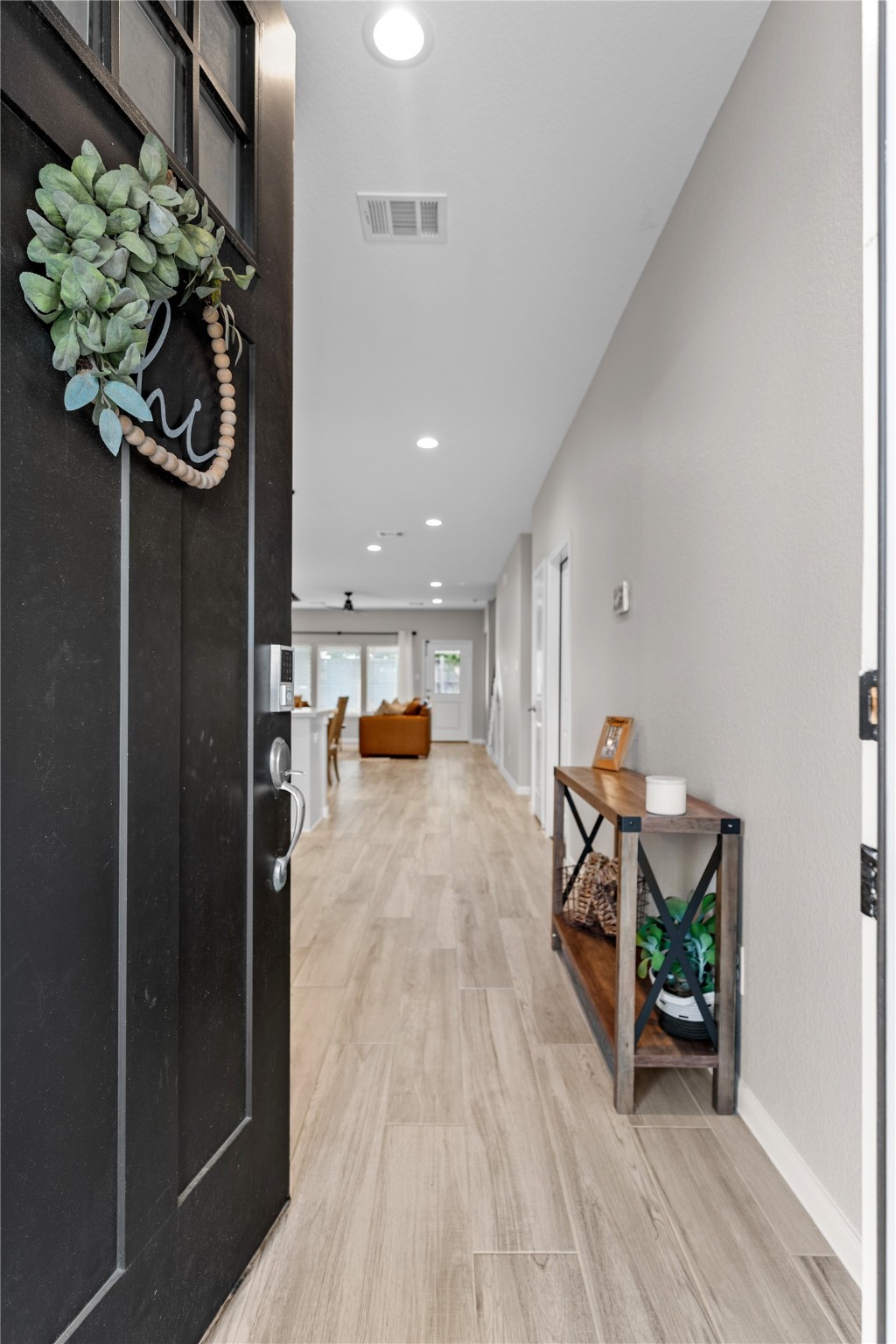 2504 Hagerman Road Conroe, TX 77384 - Photo 4 of 50 a view of a dining room with furniture window and wooden floor