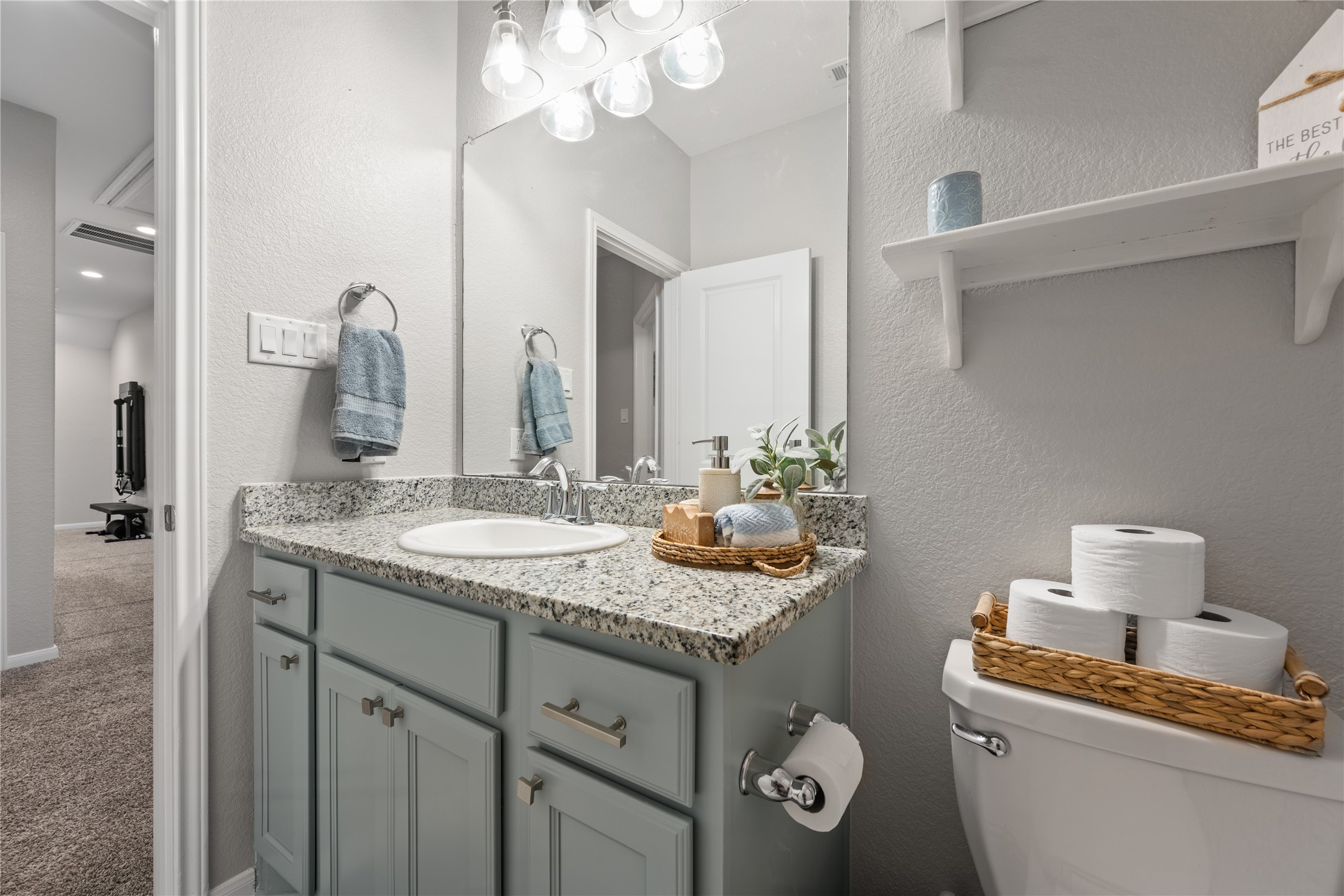 2504 Hagerman Road Conroe, TX 77384 - Photo 42 of 50 a bathroom with a granite countertop sink and a mirror