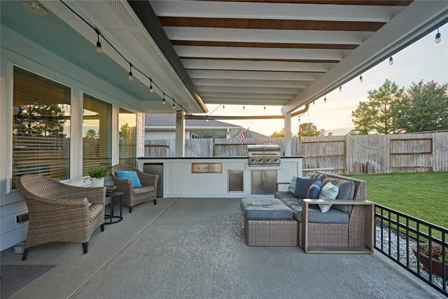 a view of a swimming pool with a patio and a yard
