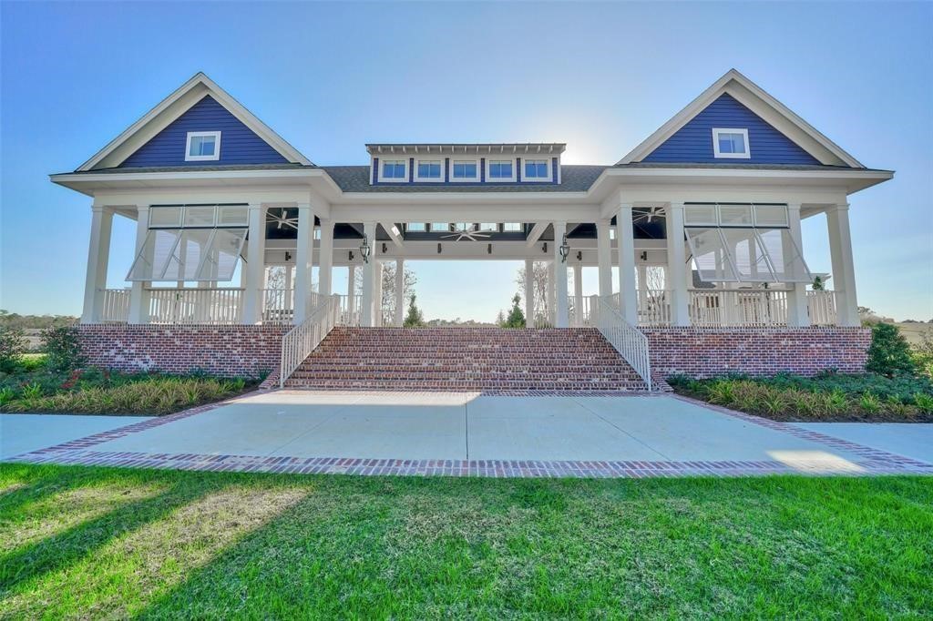 2504 Hagerman Road Conroe, TX 77384 - Photo 49 of 50 a front view of a house with garden