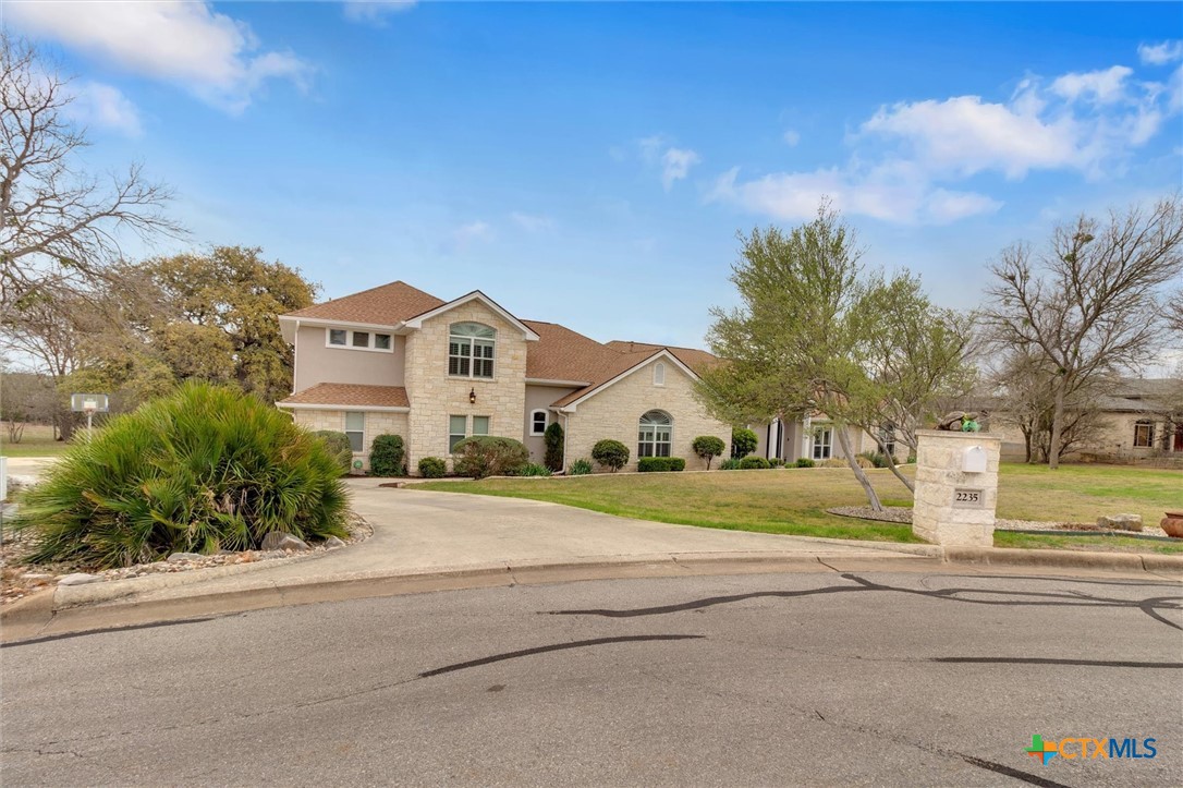2235 Summit Ridge San Marcos, TX 78666 - Photo 1 of 38 a big house with a big yard and large trees