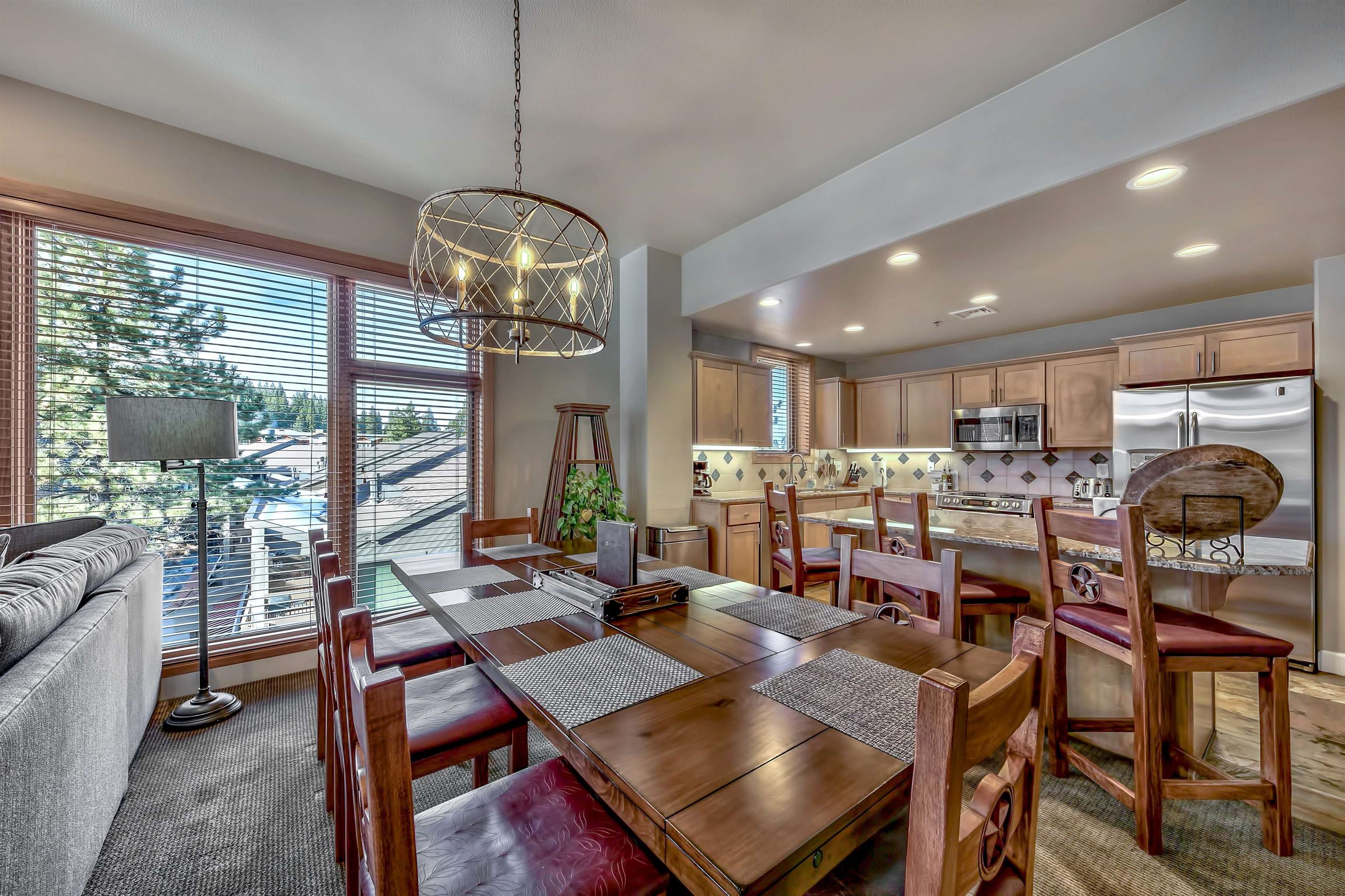2100 North Village Drive, Unit 202/2 Truckee, CA 96161 - Photo 18 of 20 a view of a dining room with furniture wooden floor and chandelier