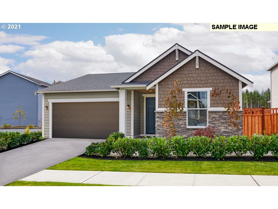 3002 North Mccanta Way Ridgefield, WA 98642 - Photo 1 of 10 a front view of a house with a yard and garage