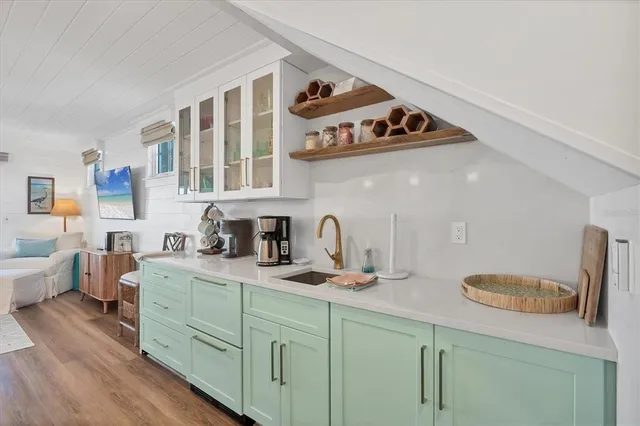 a kitchen with stainless steel appliances granite countertop a sink and a cabinets