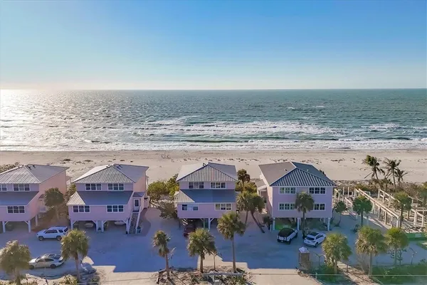 an aerial view of a house with a ocean view