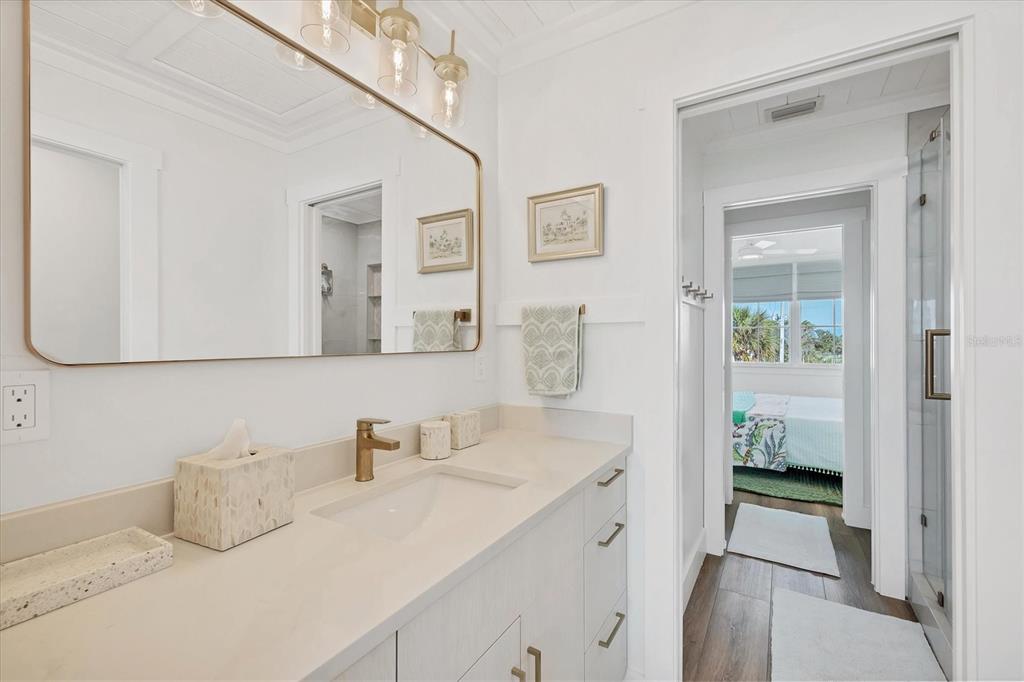 290 Gulf Boulevard, Unit 17 Boca Grande, FL 33921 - Photo 21 of 39 a en suite bathroom with a sink and a mirror