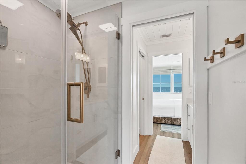290 Gulf Boulevard, Unit 17 Boca Grande, FL 33921 - Photo 22 of 39 a bathroom with a tub and shower