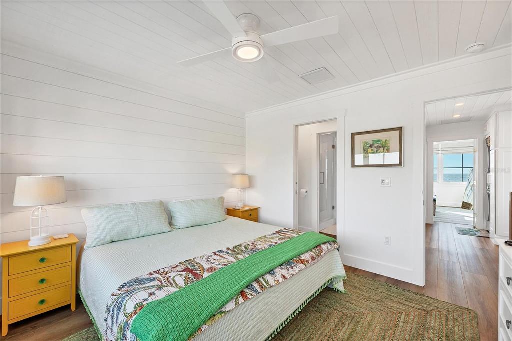 290 Gulf Boulevard, Unit 17 Boca Grande, FL 33921 - Photo 26 of 39 a bedroom with a bed and wooden floor