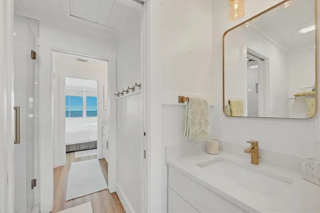 a bathroom with a sink and a mirror