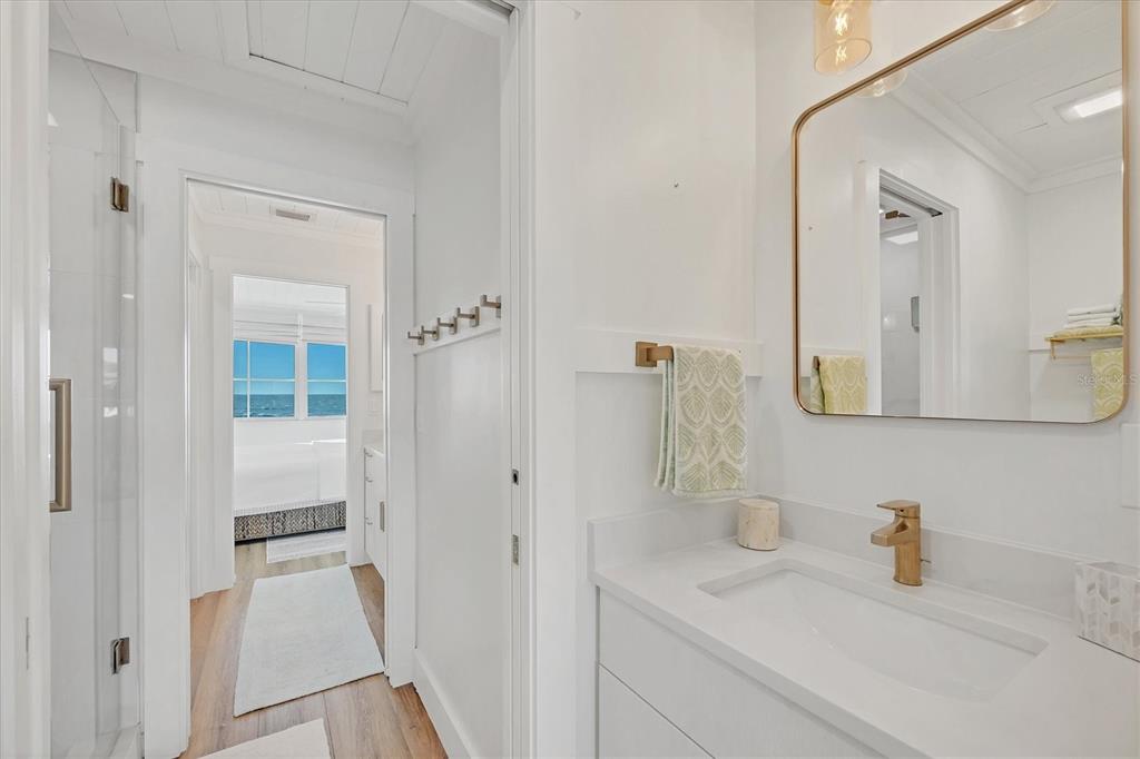 290 Gulf Boulevard, Unit 17 Boca Grande, FL 33921 - Photo 27 of 39 a bathroom with a sink and a mirror