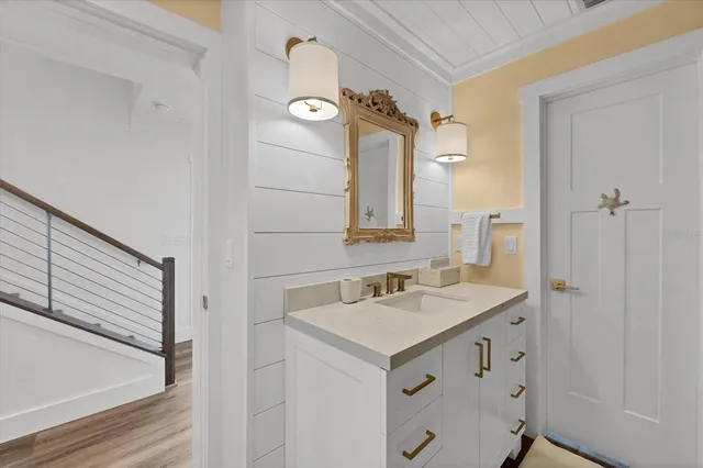 a bathroom with a sink and a mirror