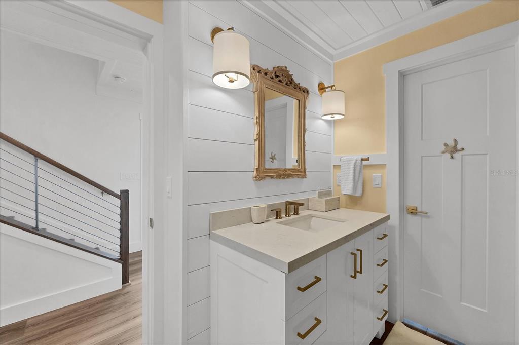 290 Gulf Boulevard, Unit 17 Boca Grande, FL 33921 - Photo 30 of 39 a bathroom with a sink and a mirror