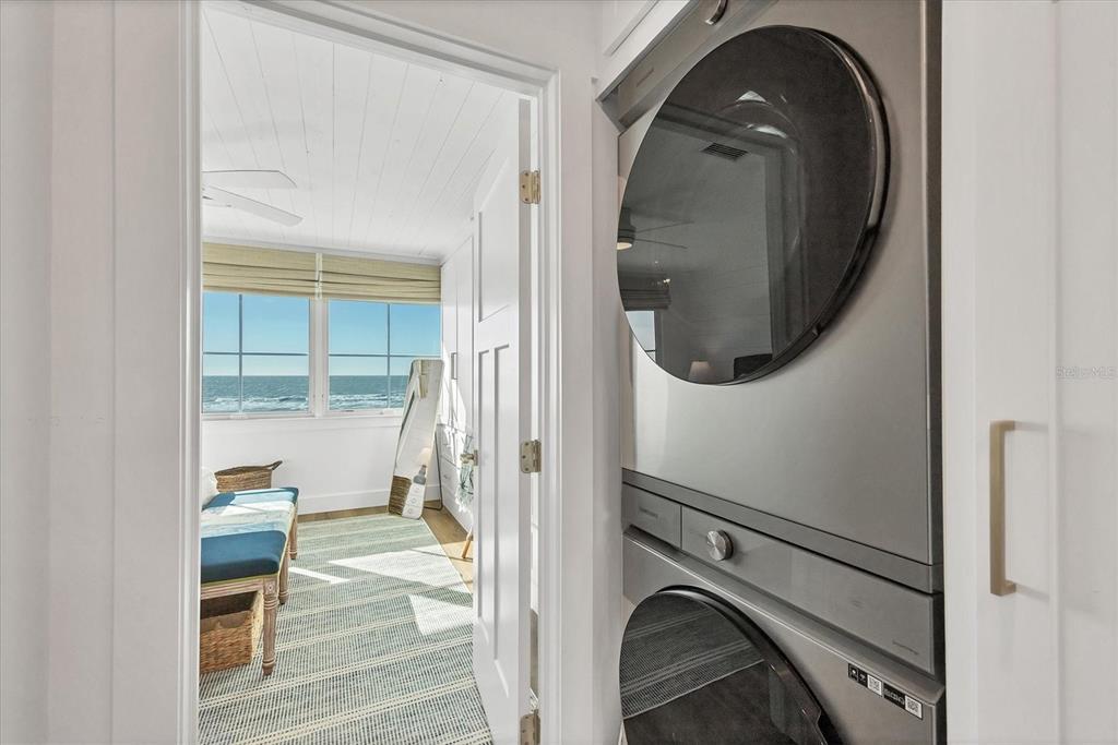 290 Gulf Boulevard, Unit 17 Boca Grande, FL 33921 - Photo 32 of 39 a utility room with mirror dryer and washer