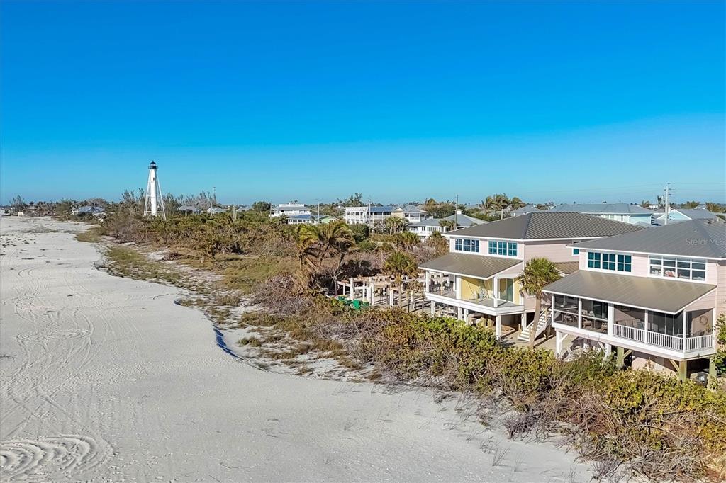 290 Gulf Boulevard, Unit 17 Boca Grande, FL 33921 - Photo 5 of 39 a view of a large building with a yard