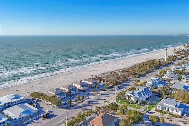 an aerial view of beach and ocean