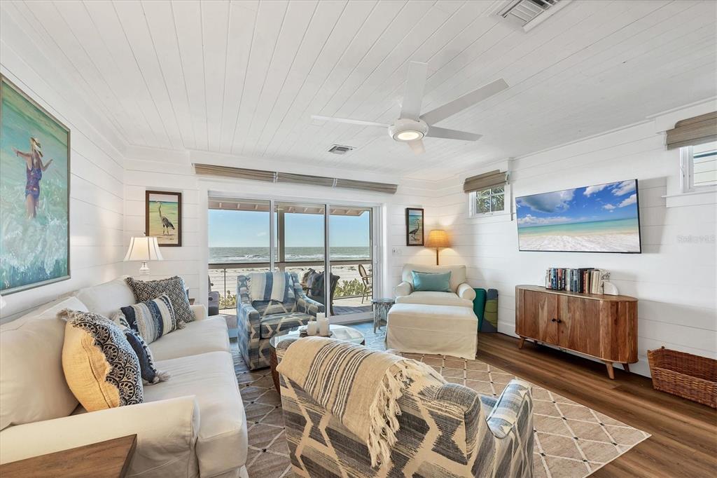 290 Gulf Boulevard, Unit 17 Boca Grande, FL 33921 - Photo 10 of 39 a bedroom with furniture and large windows