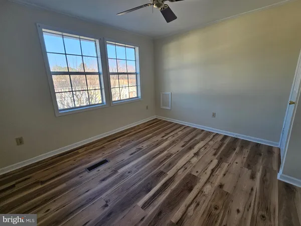 a room with a bed and a window