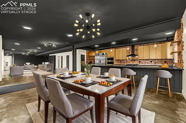 a kitchen with stainless steel appliances a stove sink and cabinets