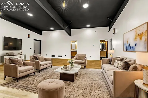 a living room with furniture and a flat screen tv