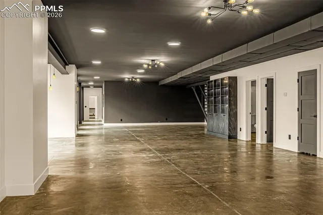 a bathroom with a toilet sink double vanity and mirror