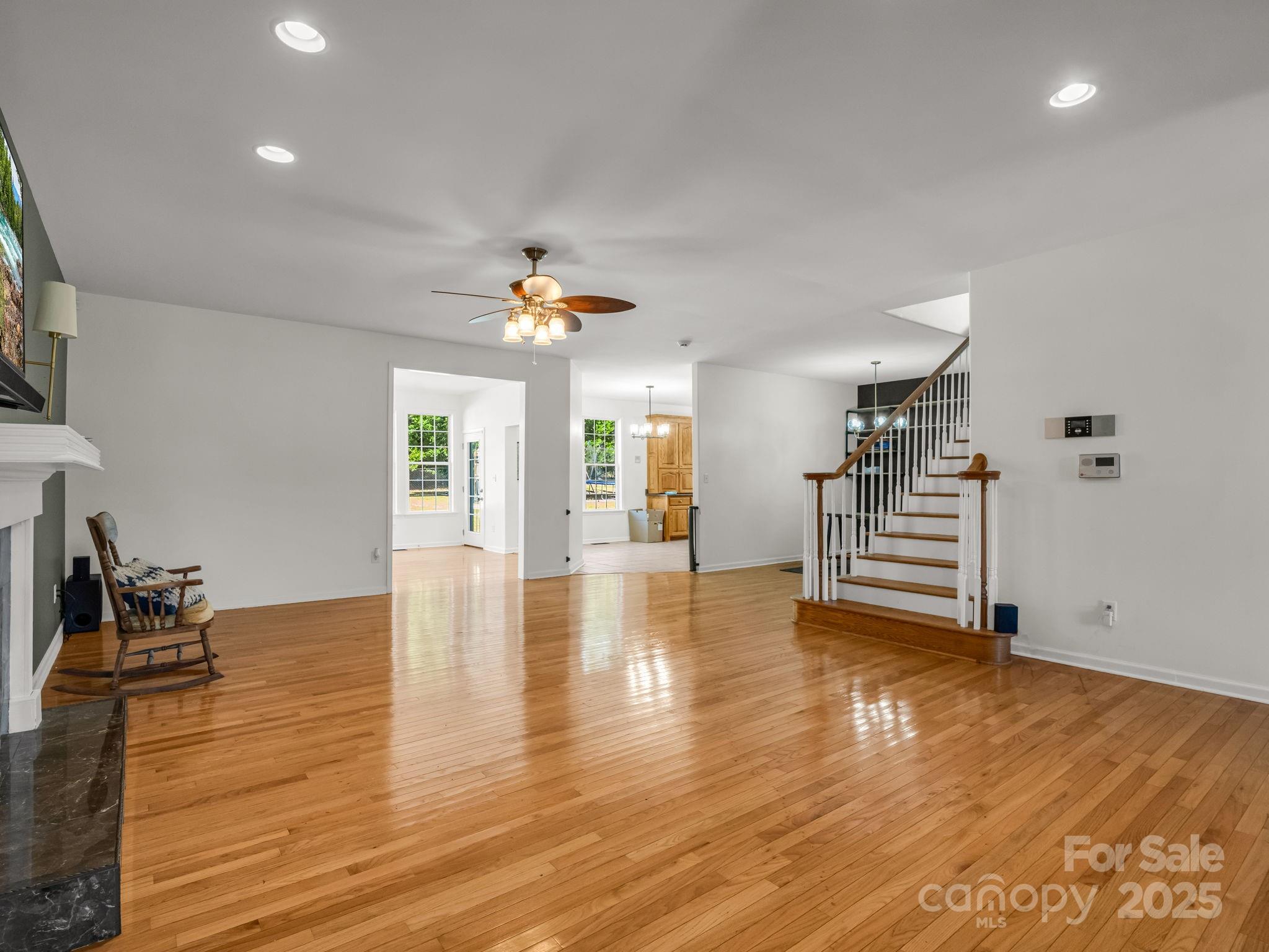 243 Laren Road Shelby, NC 28152 - Photo 9 of 47 a view of empty room with wooden floor and fireplace