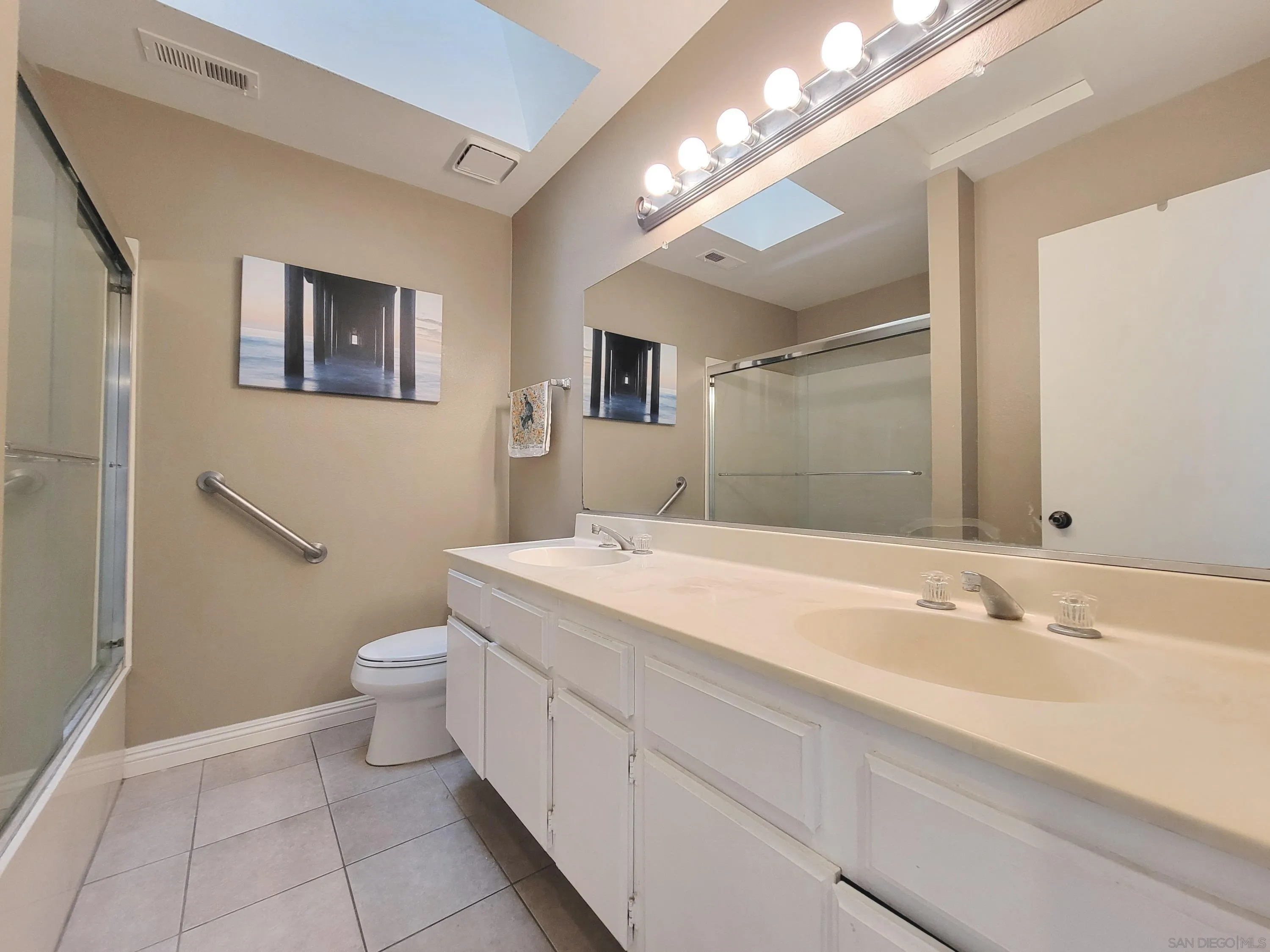 116 South Darien Drive Encinitas, CA 92024 - Photo 17 of 27 a spacious bathroom with a sink a toilet a mirror and vanity