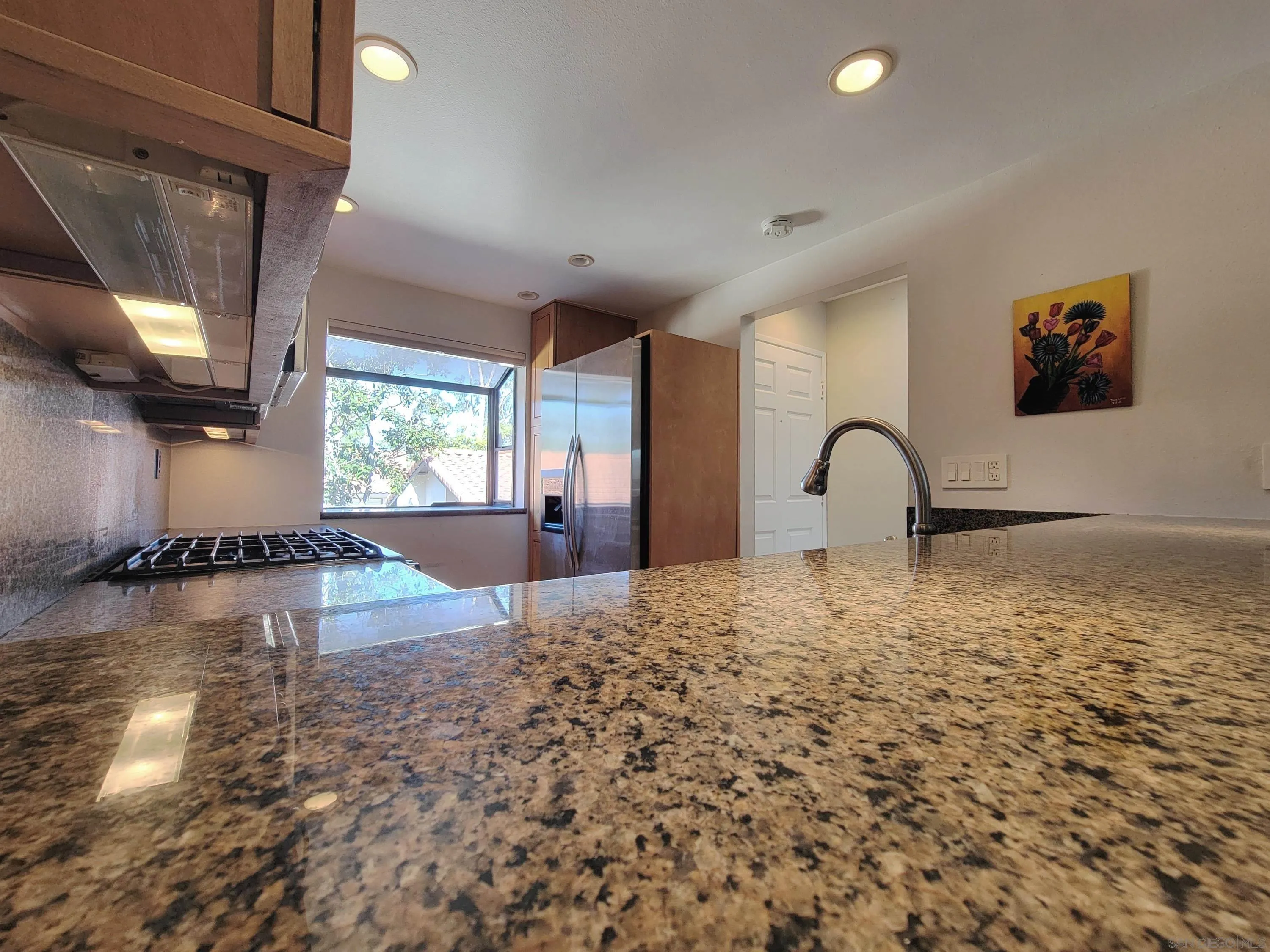 116 South Darien Drive Encinitas, CA 92024 - Photo 5 of 27 a view of a livingroom with wooden floor and a flat screen tv