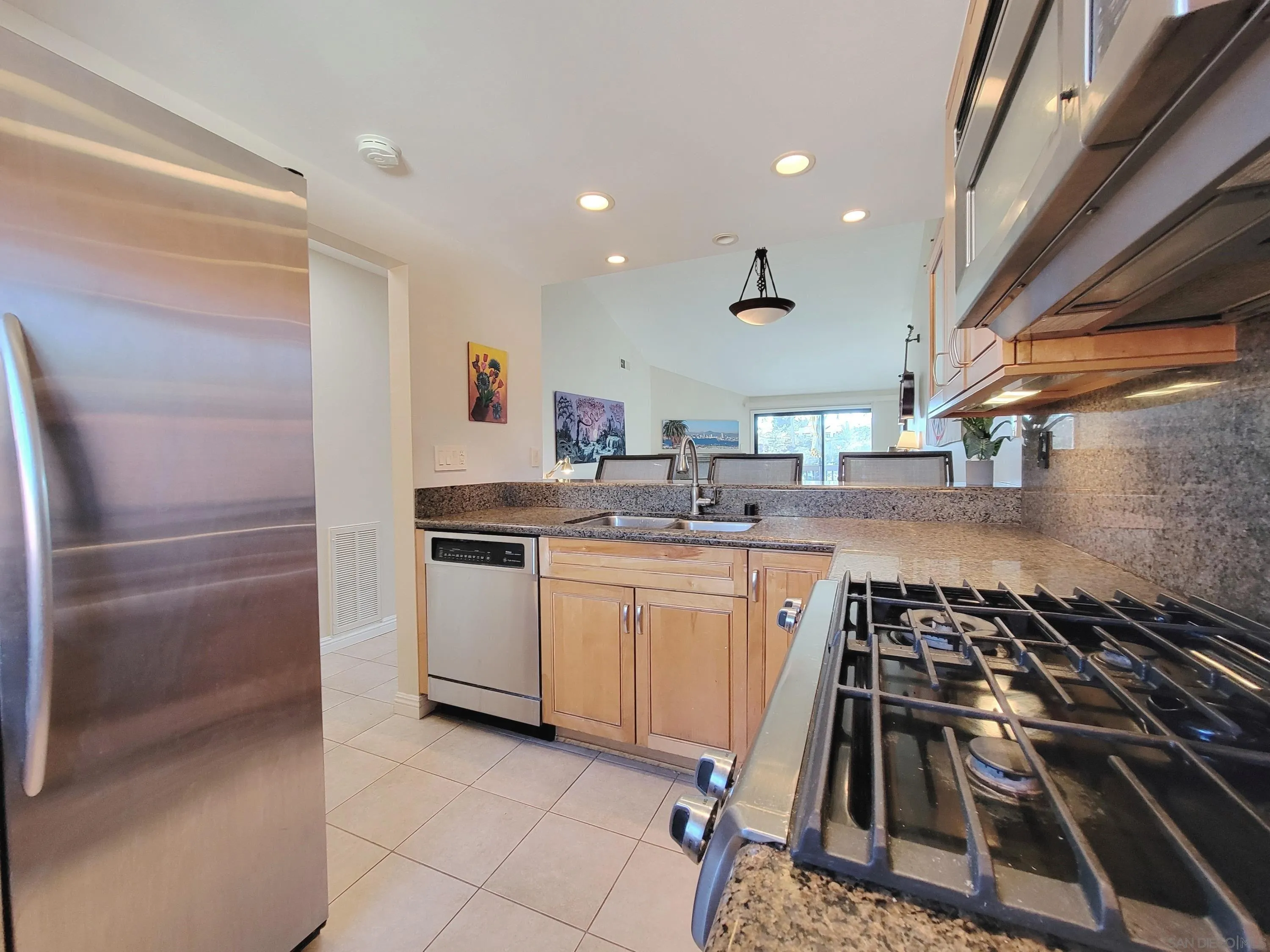 116 South Darien Drive Encinitas, CA 92024 - Photo 7 of 27 a kitchen with a sink stainless steel appliances and cabinets