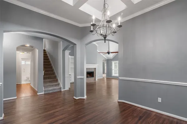 a view of hallway with furniture and a window