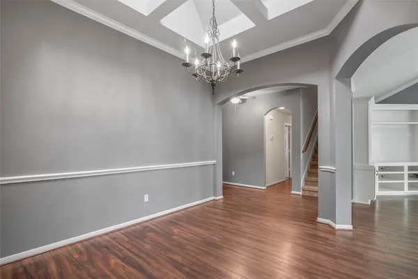 a large kitchen with kitchen island a sink stainless steel appliances and cabinets
