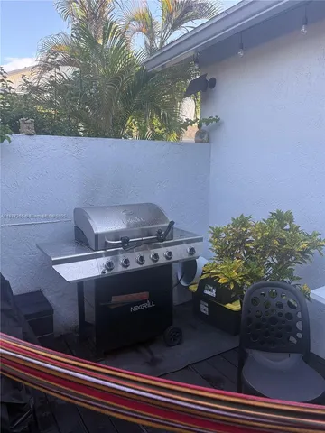 a stove top oven sitting inside of a kitchen