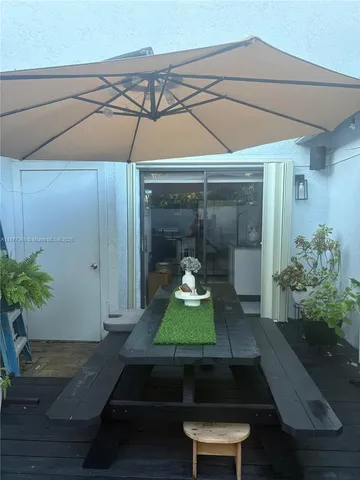 a room with wooden floor and table